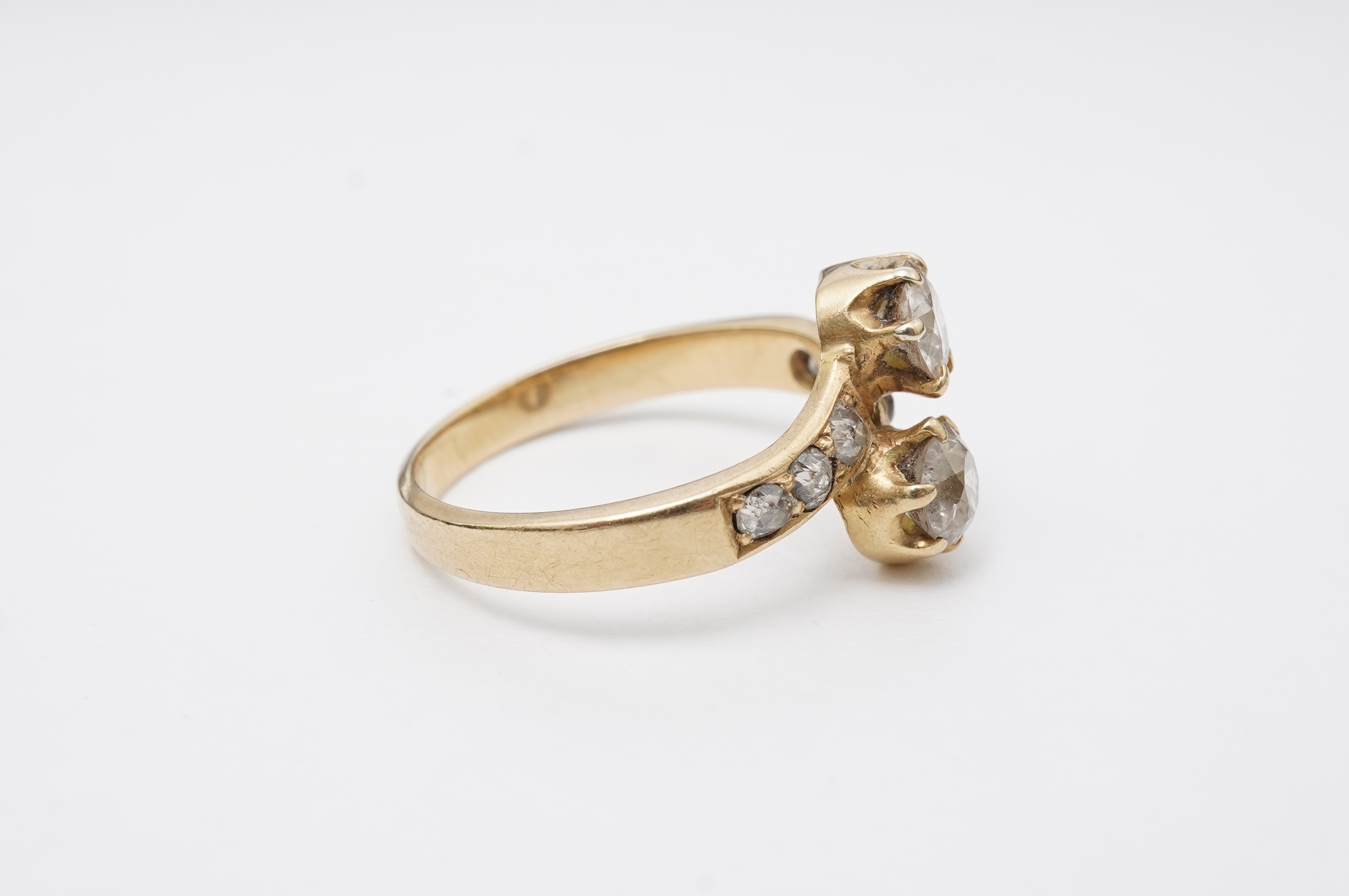 A gold and diamond 'toi-et-moi' ring, circa 1900